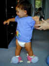 Testing out his fishy slippers...