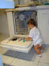 Helping mommy load the dishwasher